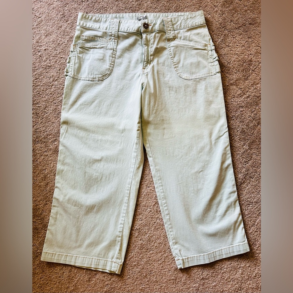 True Grit, light aqua, capri length jeans with metal buttons. Size 12, stretch.